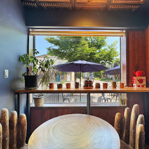 A sunny table by the front window inside Copper Kettle